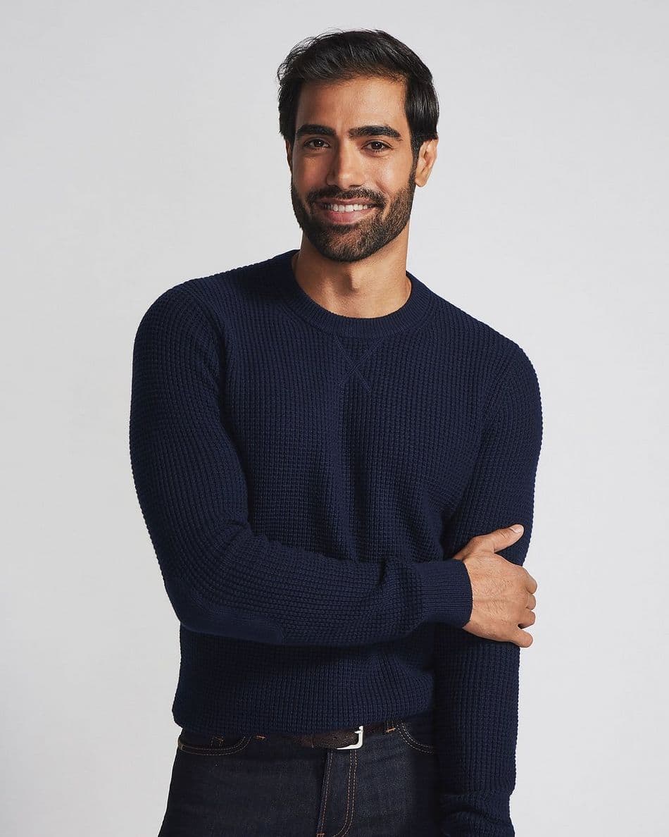 Man wearing navy sweater